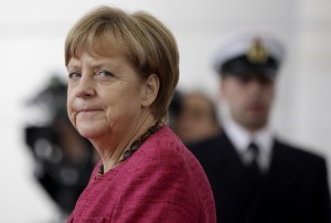 German Chancellor Angela Merkel arrives for a military welcome ceremony for the President of the Philippines, Benigno S. Aquino III. at the chancellery in Berlin, Germany, Friday, Sept. 19, 2014. (AP Photo/Michael Sohn)